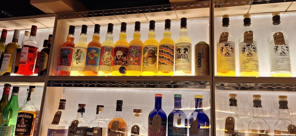 Two shelves of bottles at Cut Your Wolf Loose